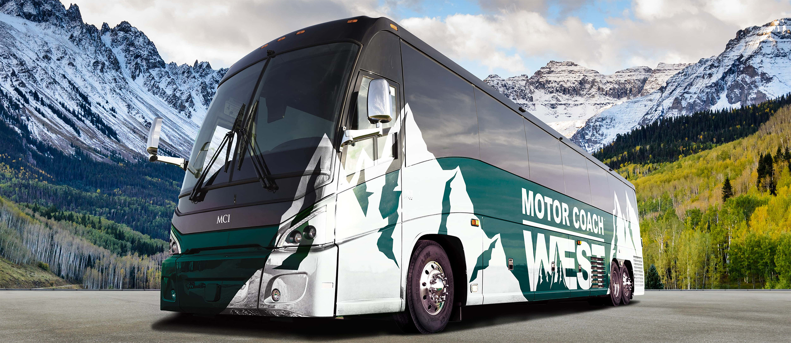 Green Motor Coach West bus against a mountain background