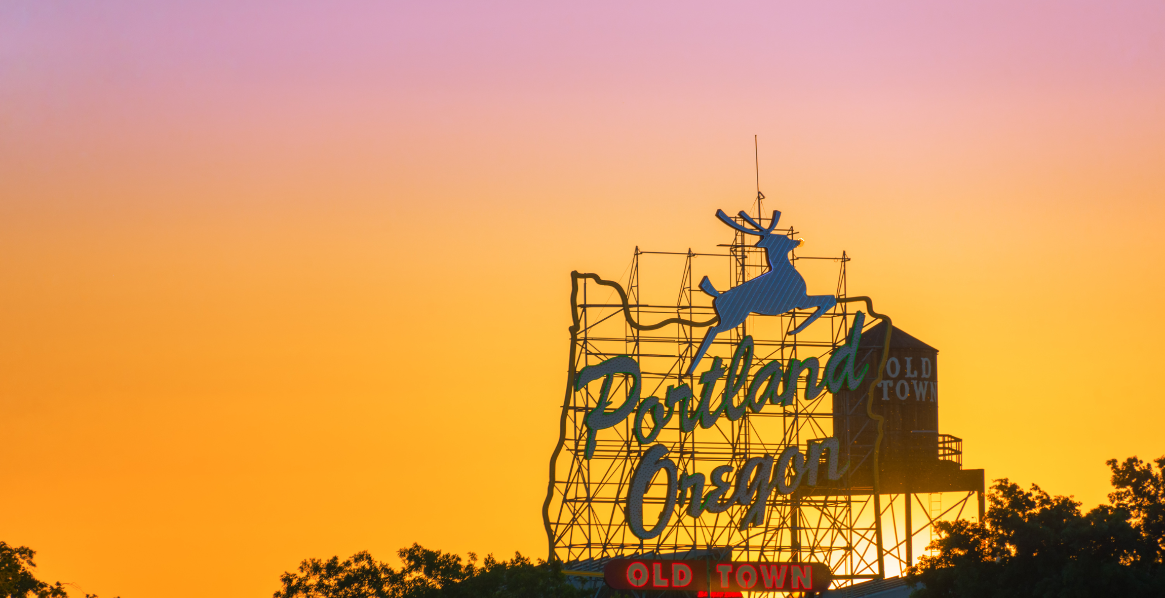 A view of the Portland Oregon welcome sign during sunset.