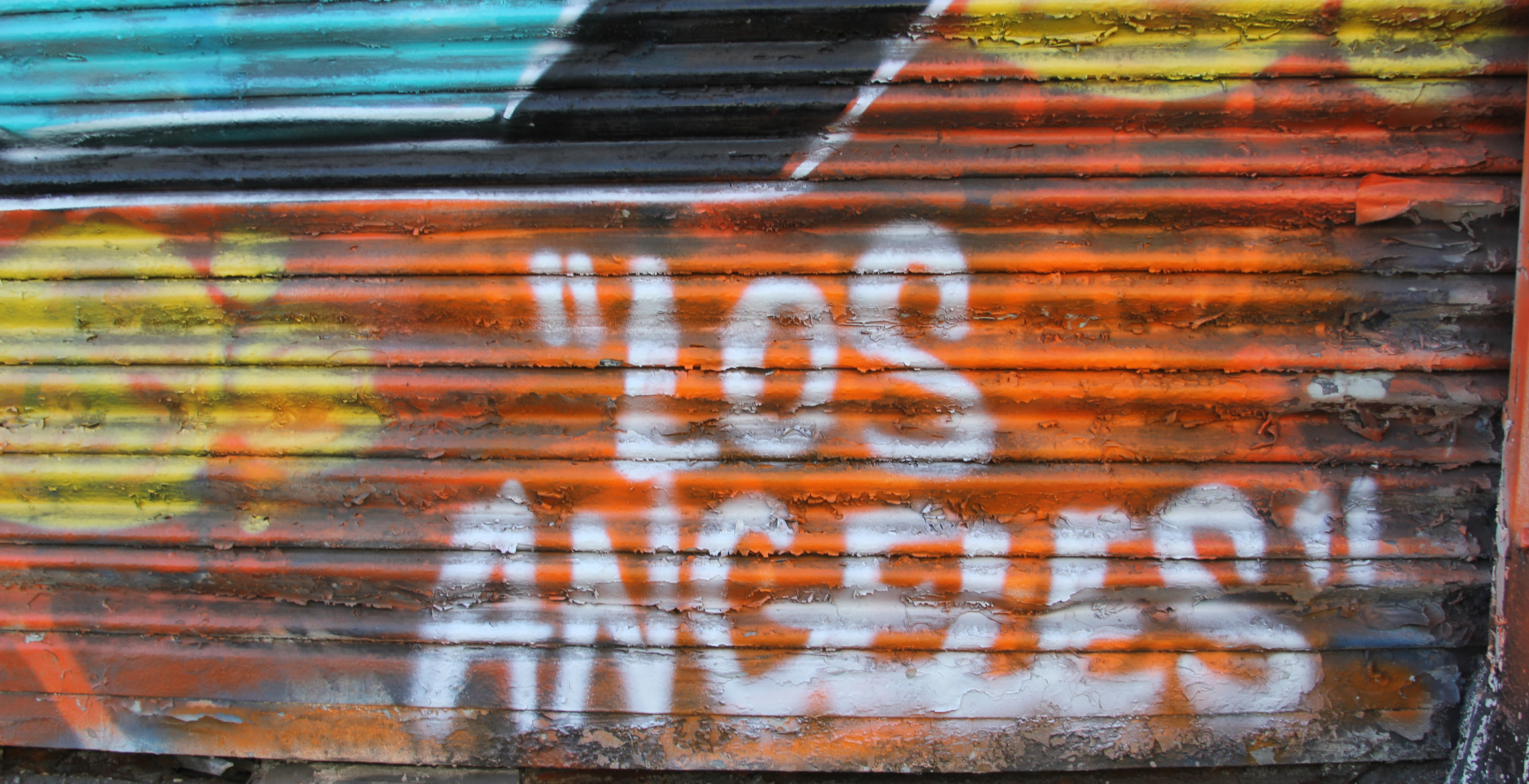 Graffiti "Los Angeles" on a rustic and painted surface 