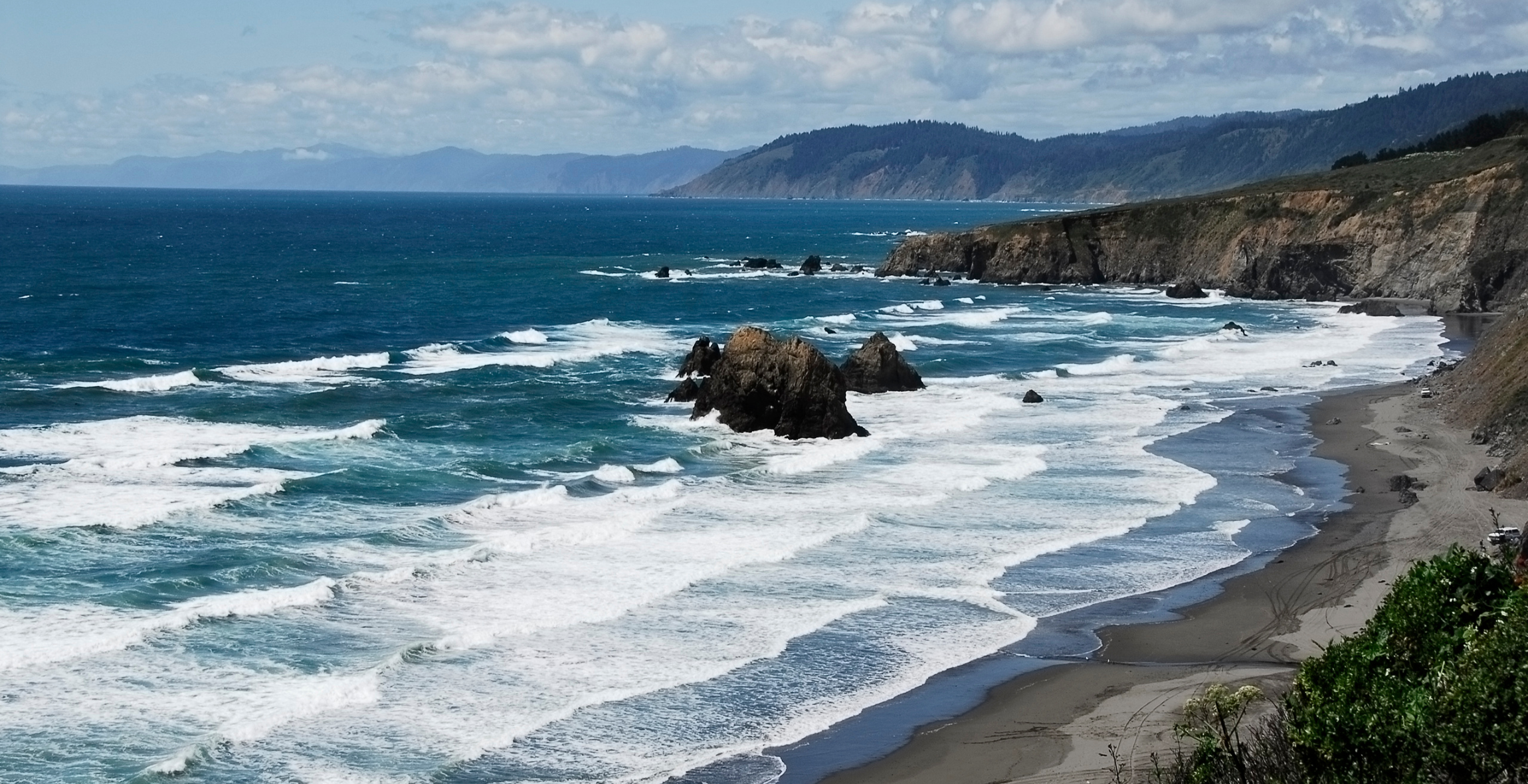 Waves roll onto the shore at Big Sur National Park, California 